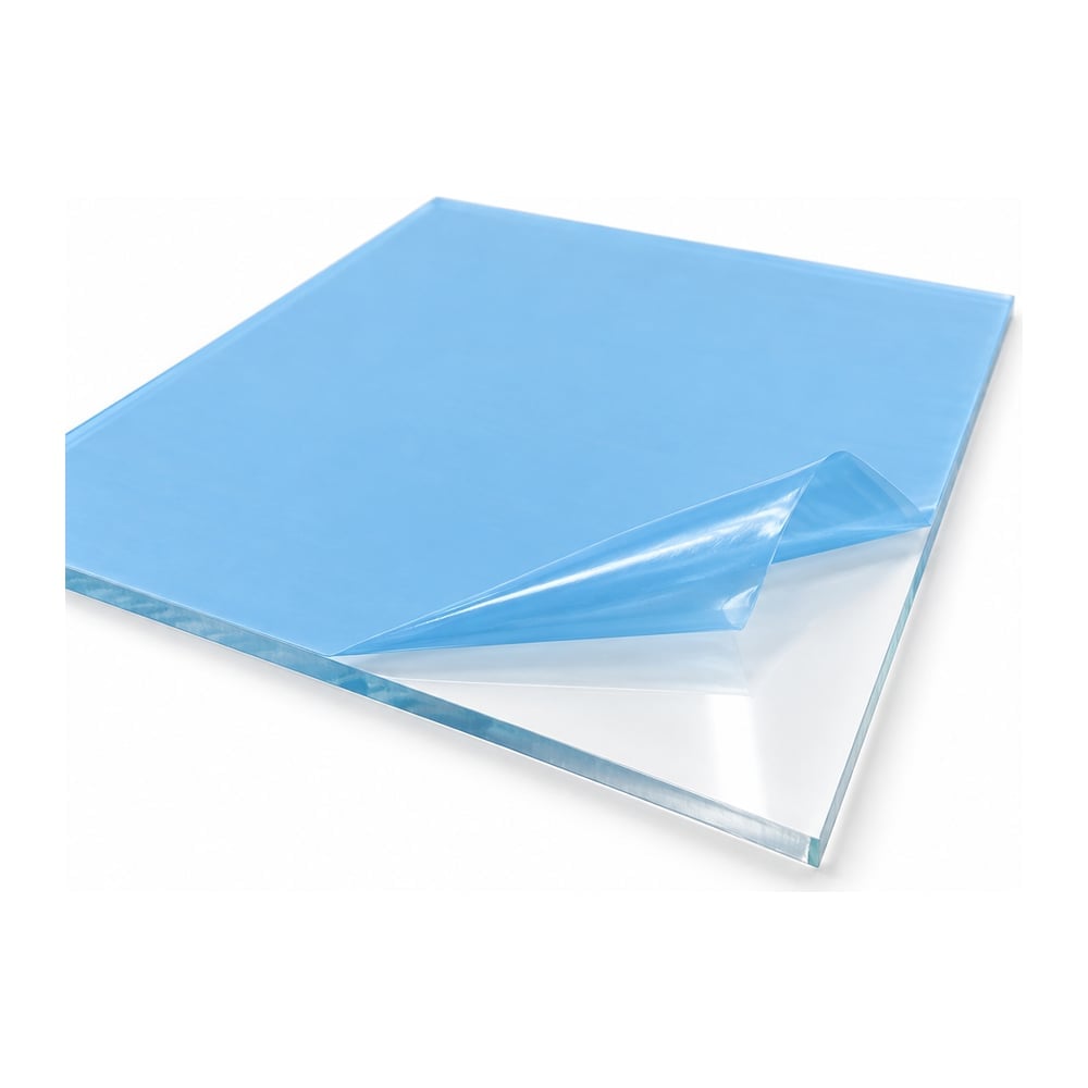 Clear polycarbonate sign grade sheet with glossy surface and partly peeled protective masking on white