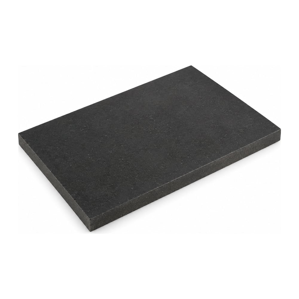Carbon fiber and graphite filled PEEK bearing grade plate, dark charcoal matte finish, angled on white