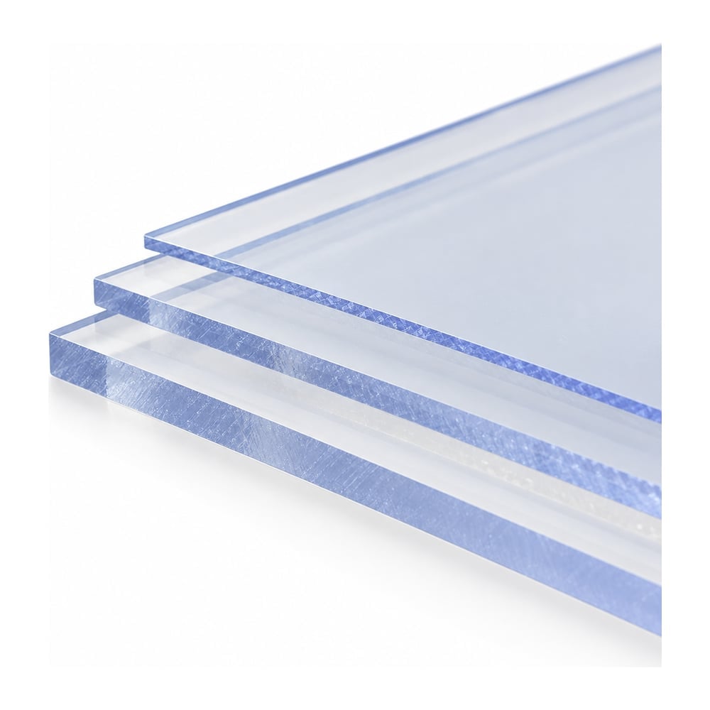 Clear polycarbonate sheets with protective masking stacked in three thicknesses on white background